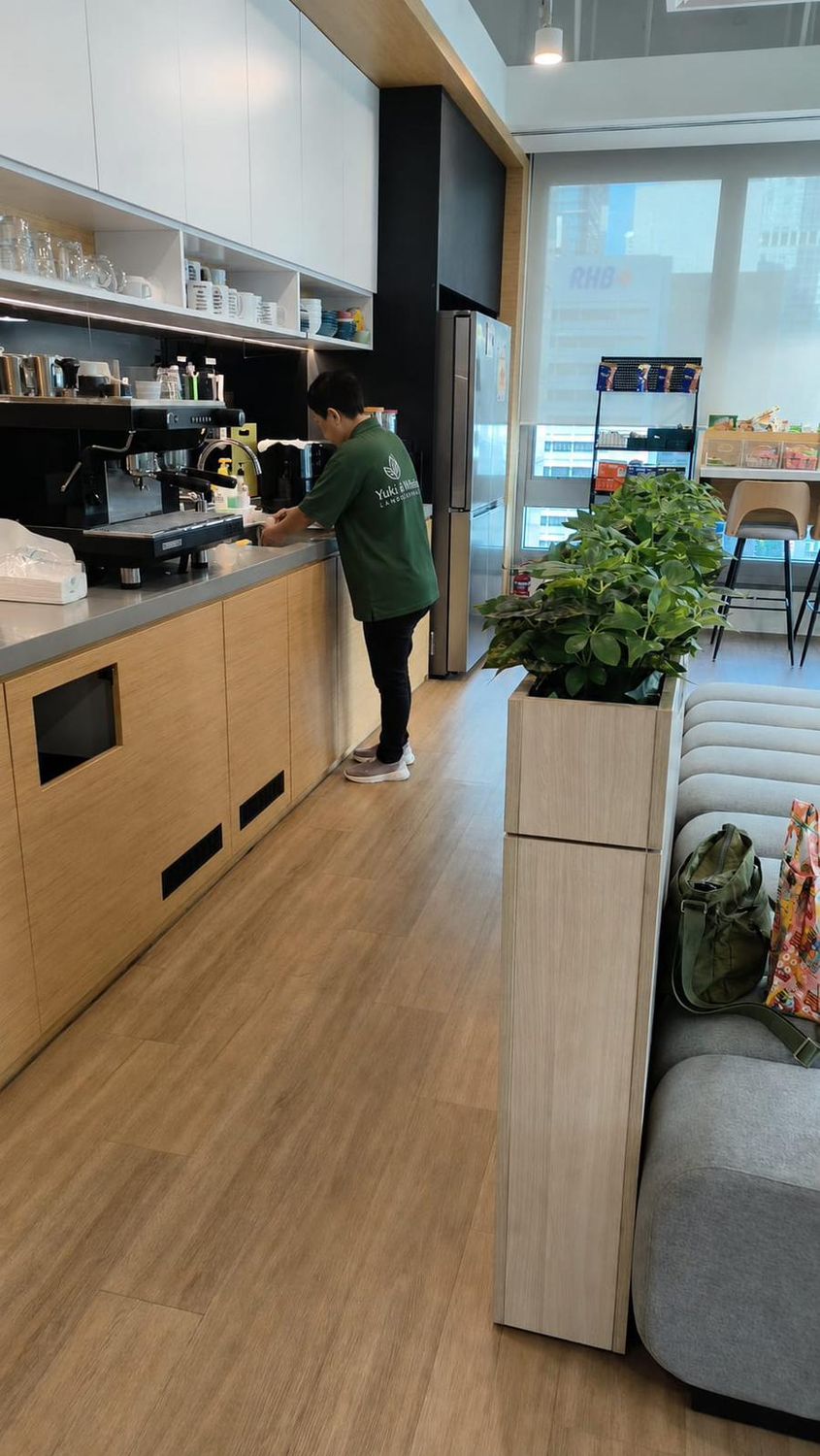 Yuki & White landscape team member at work in an office pantry